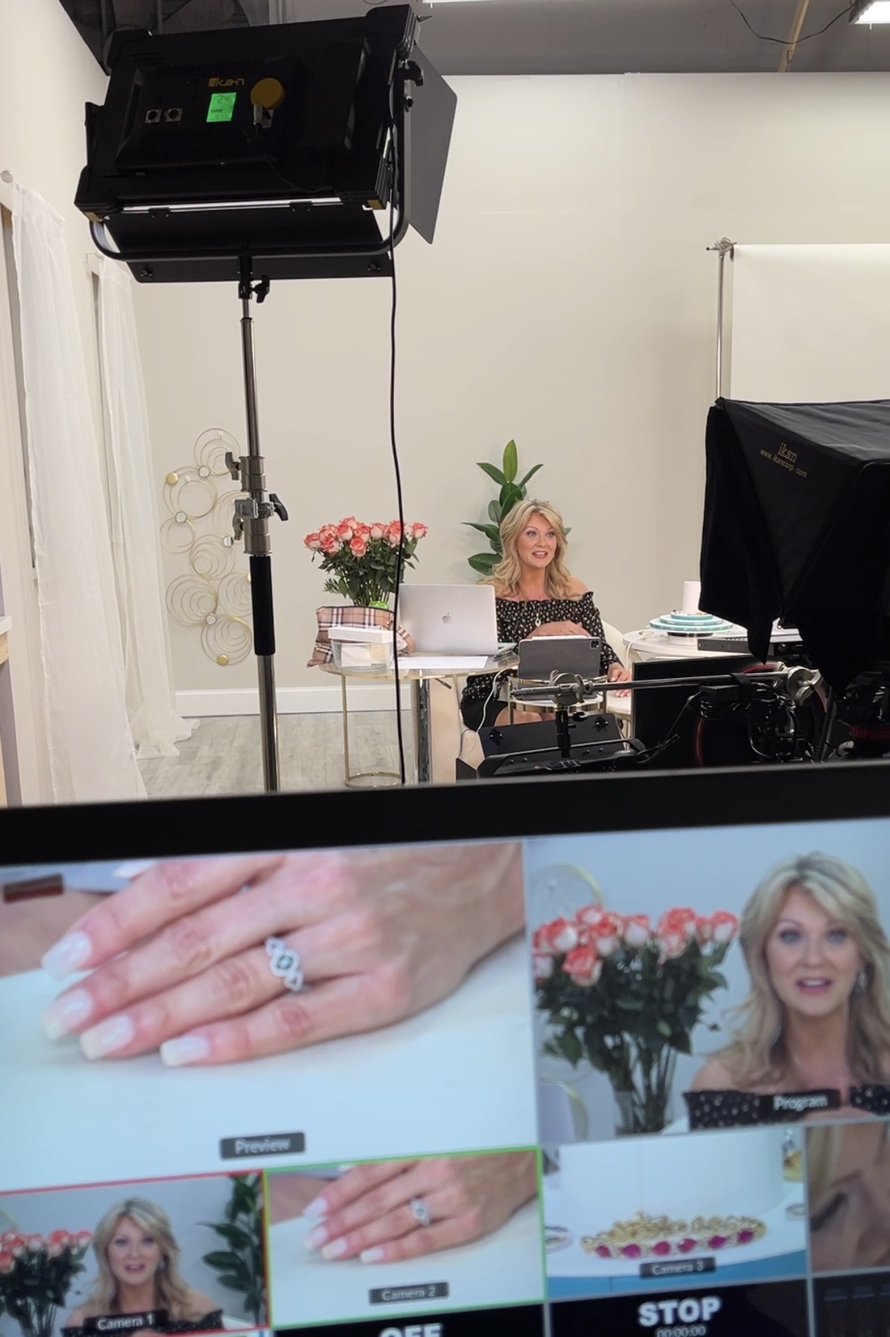 Woman presenting in 7P Productions studio, live social shopping setting